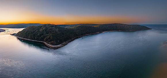 Aerial sunrise panorama over the mountains and waterways