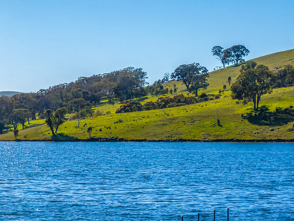 Aerial scenic views over Carcoar Dam with blue sky