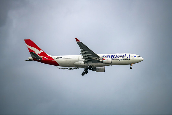 Qantas (Oneworld Livery)VH-EBV Aircraft in the cloudy late after