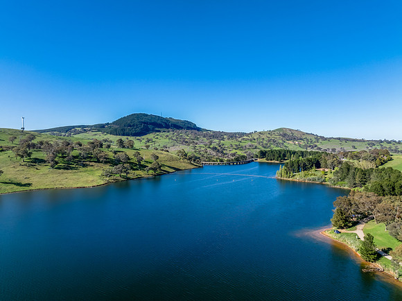 Aerial scenic views over Carcoar Dam with blue sky