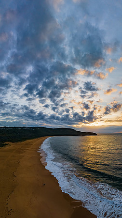 Sunrise seascape with clouds and gentle surf
