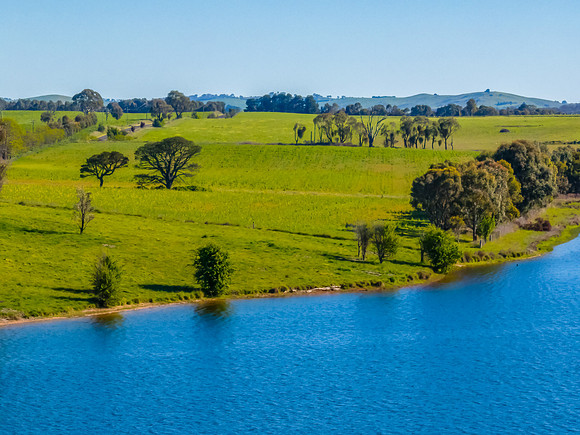 Aerial scenic views over Carcoar Dam with blue sky