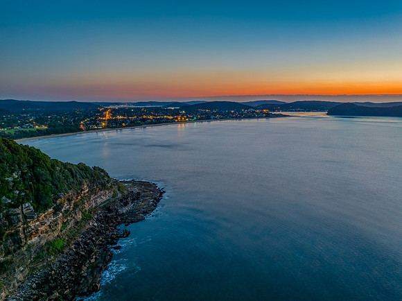 Aerial sunrise over the calm sea and smoke haze clear sky