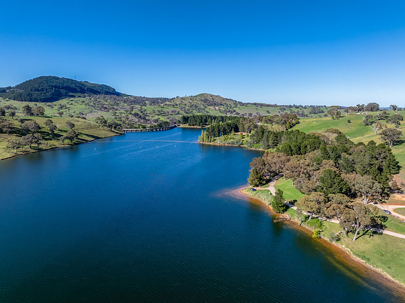 Aerial scenic views over Carcoar Dam with blue sky