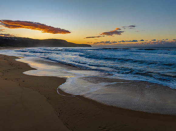 Aerial sunrise at the beach with clouds