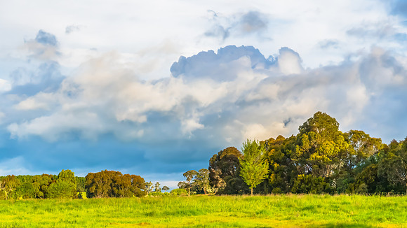 Spring landscape in the countryside with rain clouds