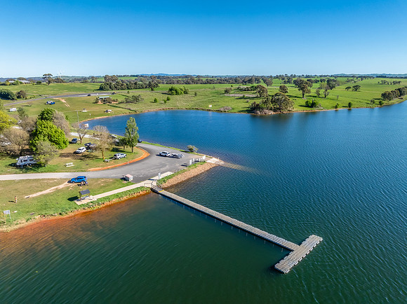 Aerial scenic views over Carcoar Dam with blue sky