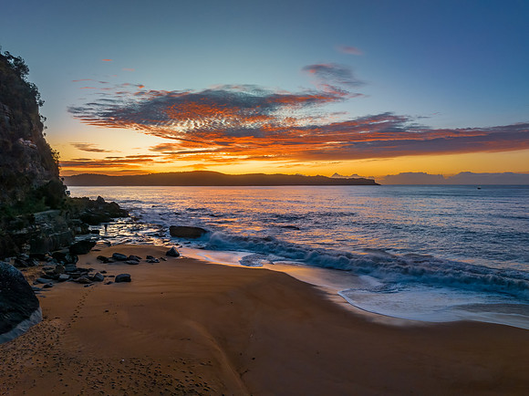Aerial sunrise seascape with high cloud
