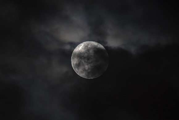 Cloud‑Covered Night Sky and the Full Moon