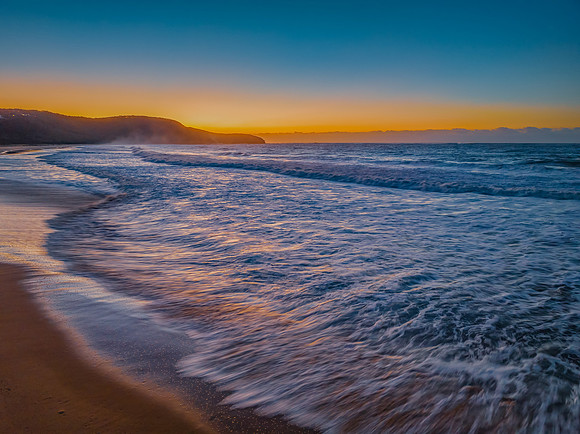 Sunrise and waves at the seaside