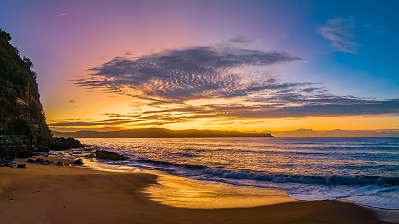 Aerial sunrise seascape panorama with high cloud