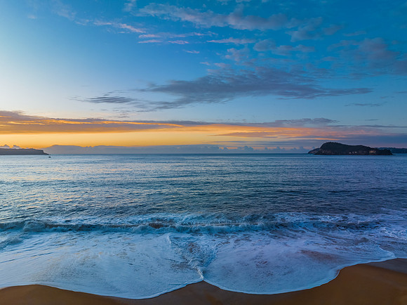 Aerial sunrise seascape with high cloud