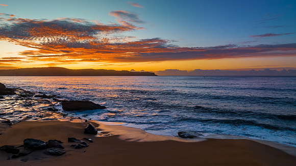 Aerial sunrise seascape with high cloud