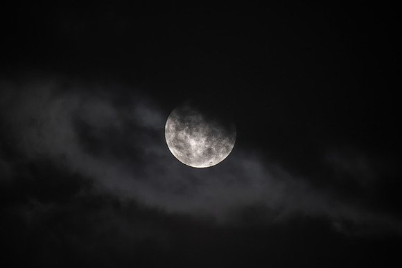 Cloud‑Covered Night Sky and the Full Moon