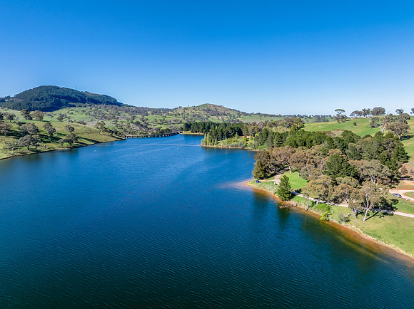 Aerial scenic views over Carcoar Dam with blue sky