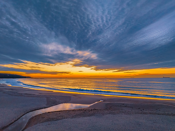 Sunrise at the seaside with beautiful cloudcover