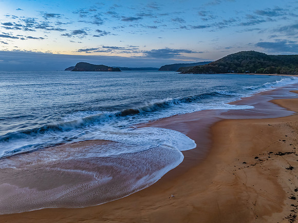 Sunrise, clouds and surf at the seaside