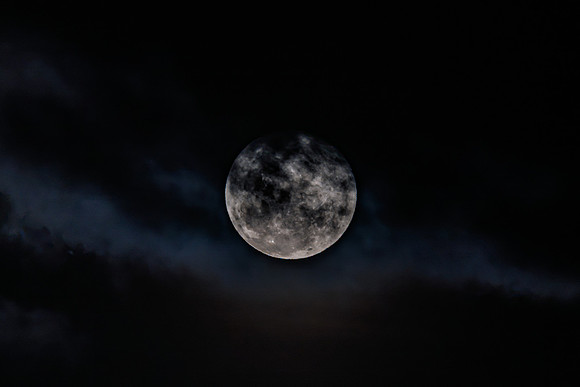Cloud‑Covered Night Sky and the Full Moon