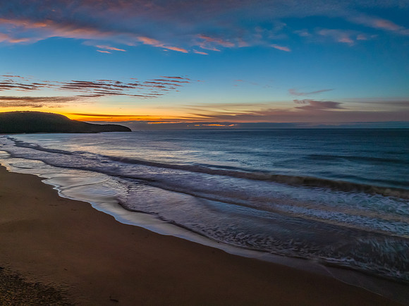 Winter seascape views over the beach with high and medium cloud