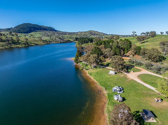Aerial scenic views over Carcoar Dam with blue sky