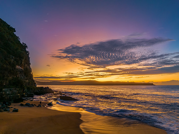 Aerial sunrise seascape with high cloud