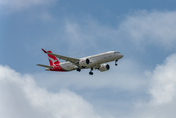 VH-X4B - Airbus A220-300 - QantasLink Aircraft in the blue sky w