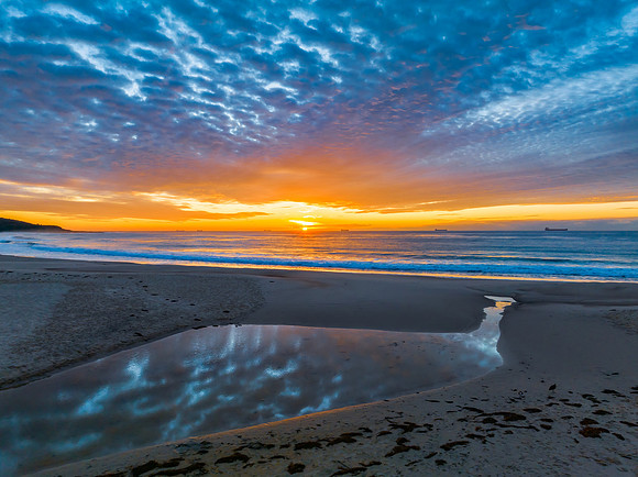 Sunrise at the seaside with beautiful cloudcover