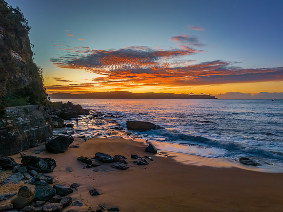 Aerial sunrise seascape with high cloud