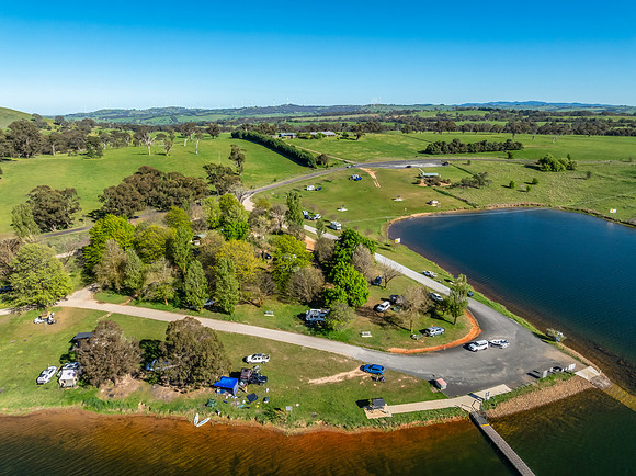 Aerial scenic views over Carcoar Dam with blue sky
