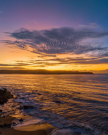 Aerial sunrise seascape with high cloud