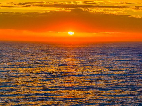Pretty Sunrise at the seaside with rain clouds
