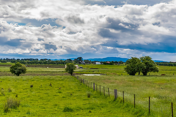 Spring landscape in the countryside with rain clouds