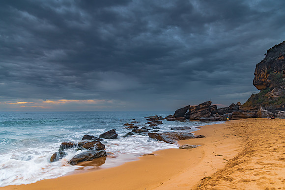 Sunrise at the seaside with rocks and beautiful diffused light b