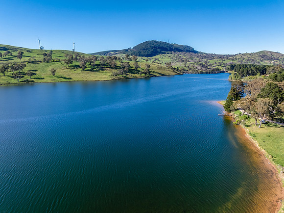 Aerial scenic views over Carcoar Dam with blue sky