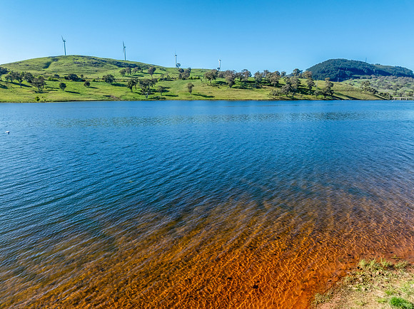 Aerial scenic views over Carcoar Dam with blue sky