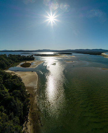 Mallacoota Inlet glistening in the morning sun where the sea mee