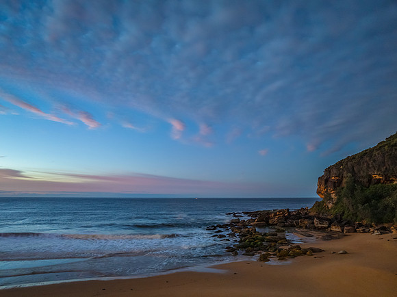 Winter seascape views over the beach with high and medium cloud