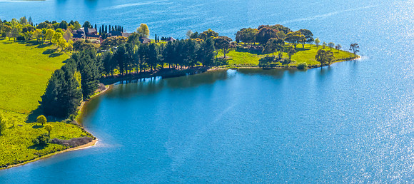 Aerial scenic views over Carcoar Dam with blue sky