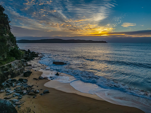 Sunrise, clouds and surf at the seaside