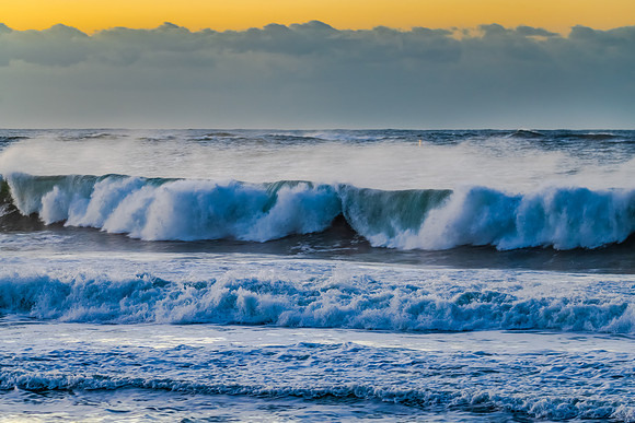 Sunrise and waves at the seaside