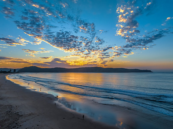 Sunrise seascape with pretty clouds in the sky