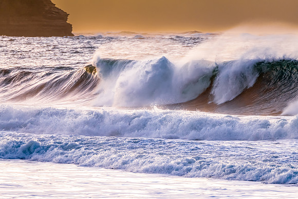 Sunrise and waves at the seaside