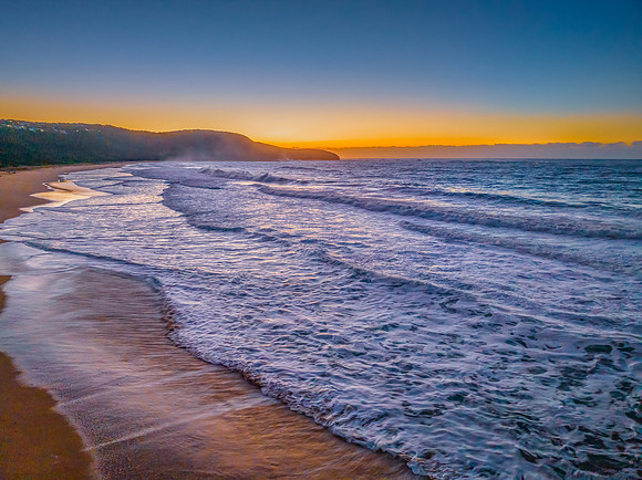 Sunrise and waves at the seaside