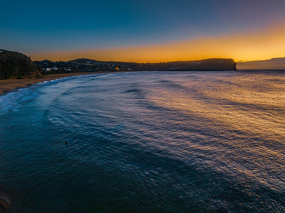 Sunrise over the ocean with low cloud bank