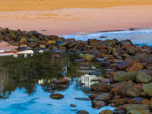 Aerial sunrise at the seaside in shades of blue and grey