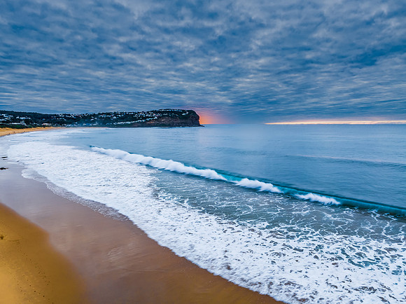 Stratus cloud filled sunrise over the ocean