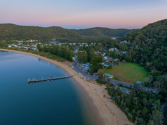 Sunrise views over the bay with boats and mountain ranges from P