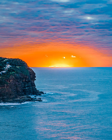 Stratus cloud filled sunrise over the ocean