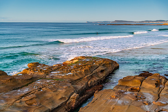 Sunrise seascape with rock platform