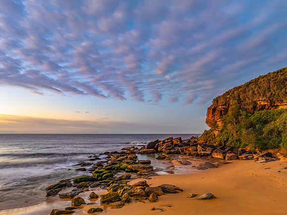 Winter seascape views over the beach with high and medium cloud